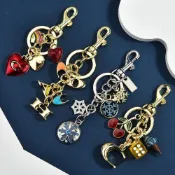 Metal keychain with fruit and diamond-encrusted apple pendan