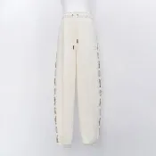【PUMA】流行系列 Melody 女款 米白色 串標 運動 休閒 抽繩 縮口 口袋 亞規 長褲 63107487