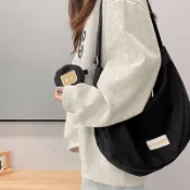 帆布包女斜挎2025新款學生單肩尼龍餃子包女式挎包百搭森系小布包