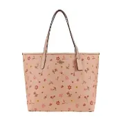 【COACH】立體馬車LOGO PVC花卉印花托特包(粉橘)