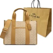 COACH 經典C LOGO緹花織布拼牛皮手提/斜背兩用琴譜大方包附紙袋(膚)