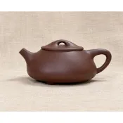 紫泥子治石瓢 早期名家壺 底款：蔣惠娟 出水：網孔 容量：約200cc