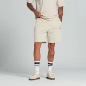 PUMA 短褲 流行系列 FLORAL SPORT 米 花卉 7吋短褲 男 68955968
