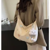 桃心帆布腋下包女小衆設計單肩通勤餃子包韓版ins百搭學生斜挎包