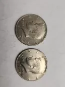 美國肯尼迪半美銀幣  2枚 年份：1974  1979 品相：老包漿 自然包漿 背面圖案：鷹徽章 正面圖案：肯尼迪總