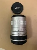 適馬Sigma 100-300mm f4.5-6.7 DL長焦鏡頭，銀色，配鏡頭蓋，成色看圖，不太懂鏡頭，不清楚啥卡口的