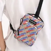 BALENCIAGA Adhesive 英字LOGO滿版緹花帆布拉鍊單肩後背包/胸口包(沙色)